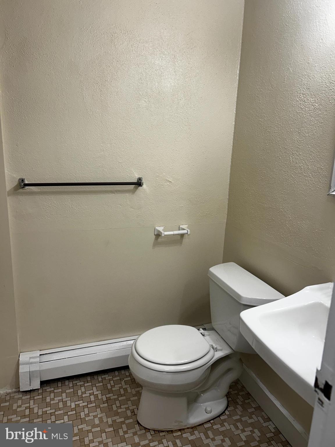 120 North Penn Street, Unit C3 Spring City, PA 19475 - Photo 7 of 8 a white toilet sitting next to a shower