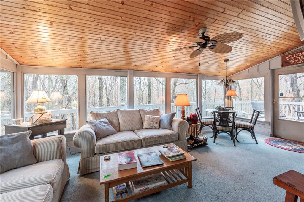 78 Ripple Creek Court Jasper, GA 30143 - Photo 13 of 43 a living room with furniture a ceiling fan and a large window