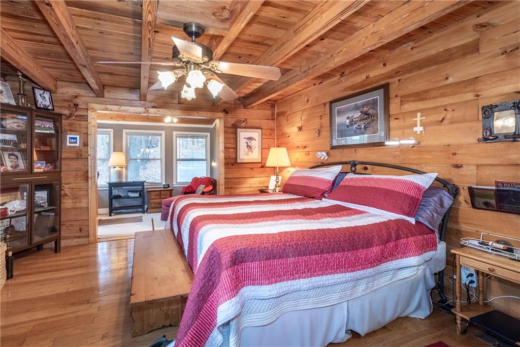 78 Ripple Creek Court Jasper, GA 30143 - Photo 17 of 43 a bed room with a bed and a chandelier