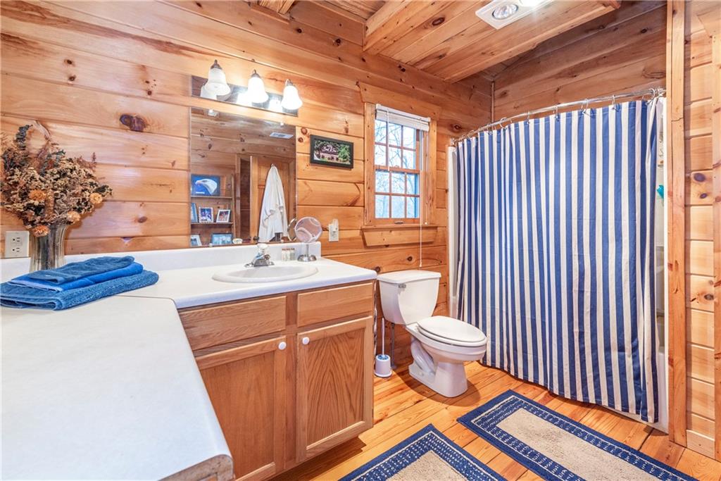 78 Ripple Creek Court Jasper, GA 30143 - Photo 28 of 43 a bathroom with a sink a toilet and shower curtain
