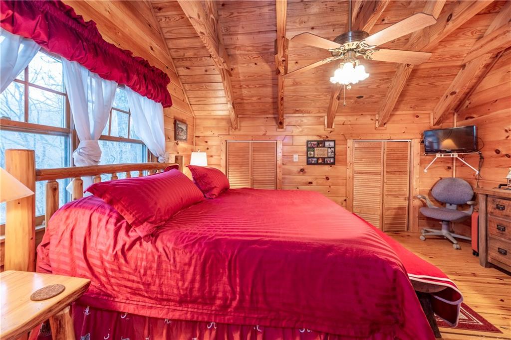 78 Ripple Creek Court Jasper, GA 30143 - Photo 30 of 43 a bed sitting in a bedroom next to a window