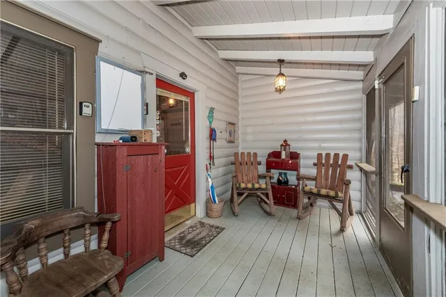 a view of a livingroom with furniture and hardwood floor