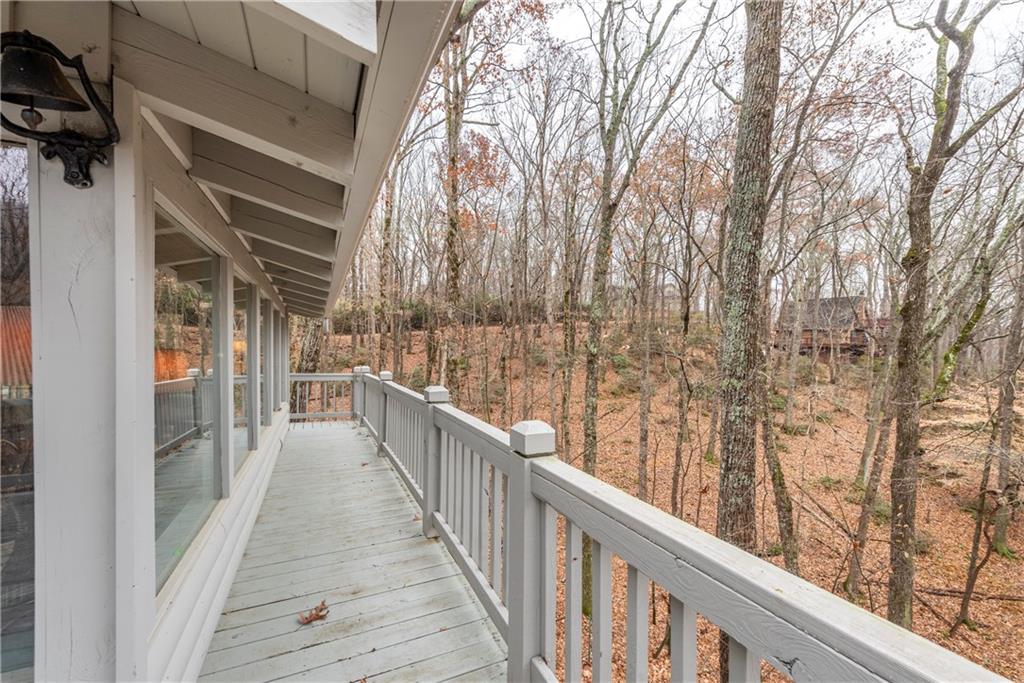 78 Ripple Creek Court Jasper, GA 30143 - Photo 42 of 43 a view of a balcony with wooden floor and fence