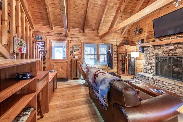 a living room with furniture fireplace and flat screen tv