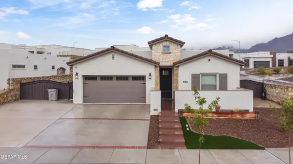 a front view of a house with a garage