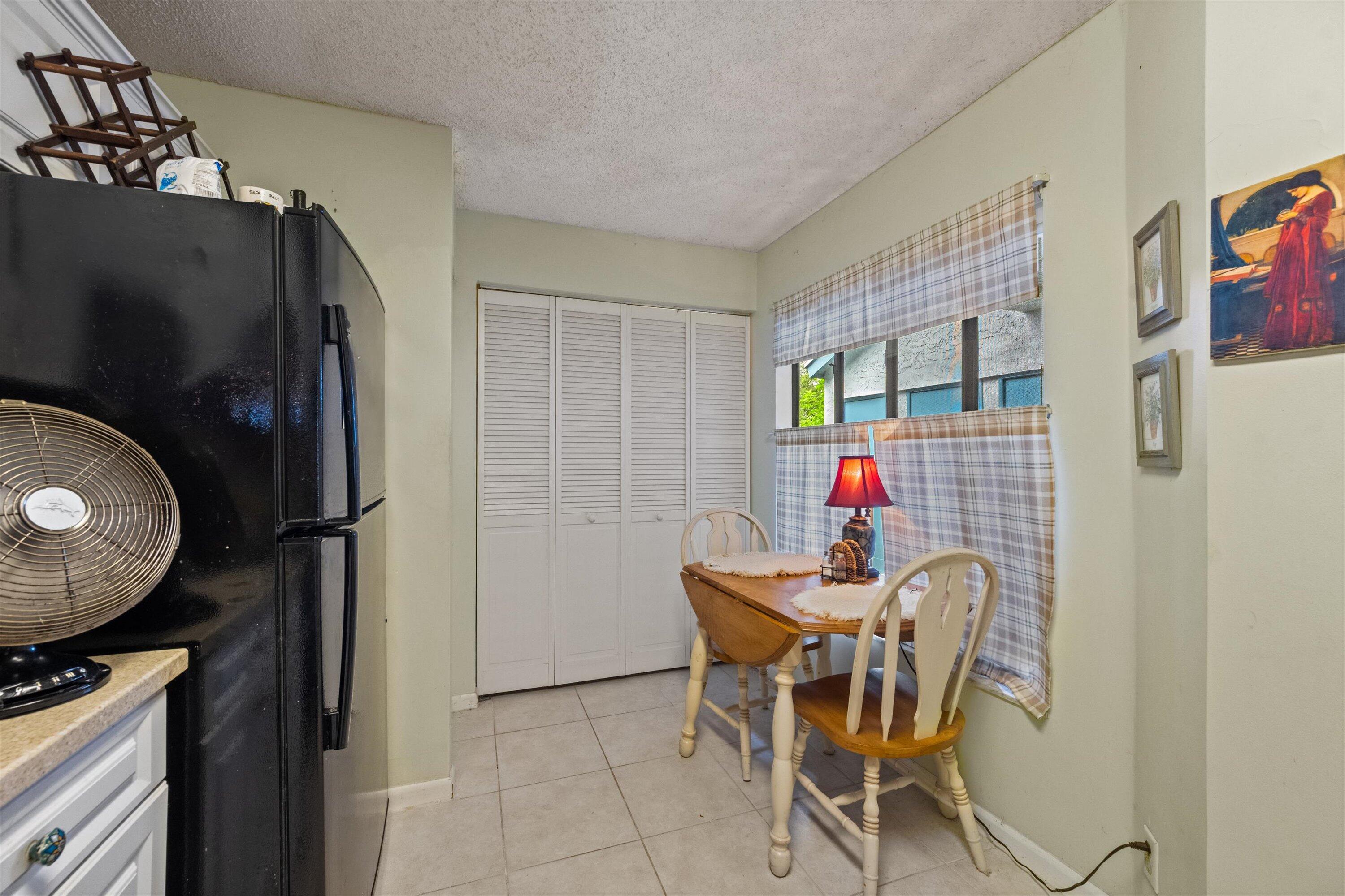 103 Harbour Pointe Way Greenacres, FL 33413 - Photo 11 of 32 a view of a dining room with furniture and front door