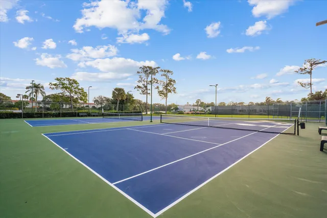 a view of an outdoor space and tennis court