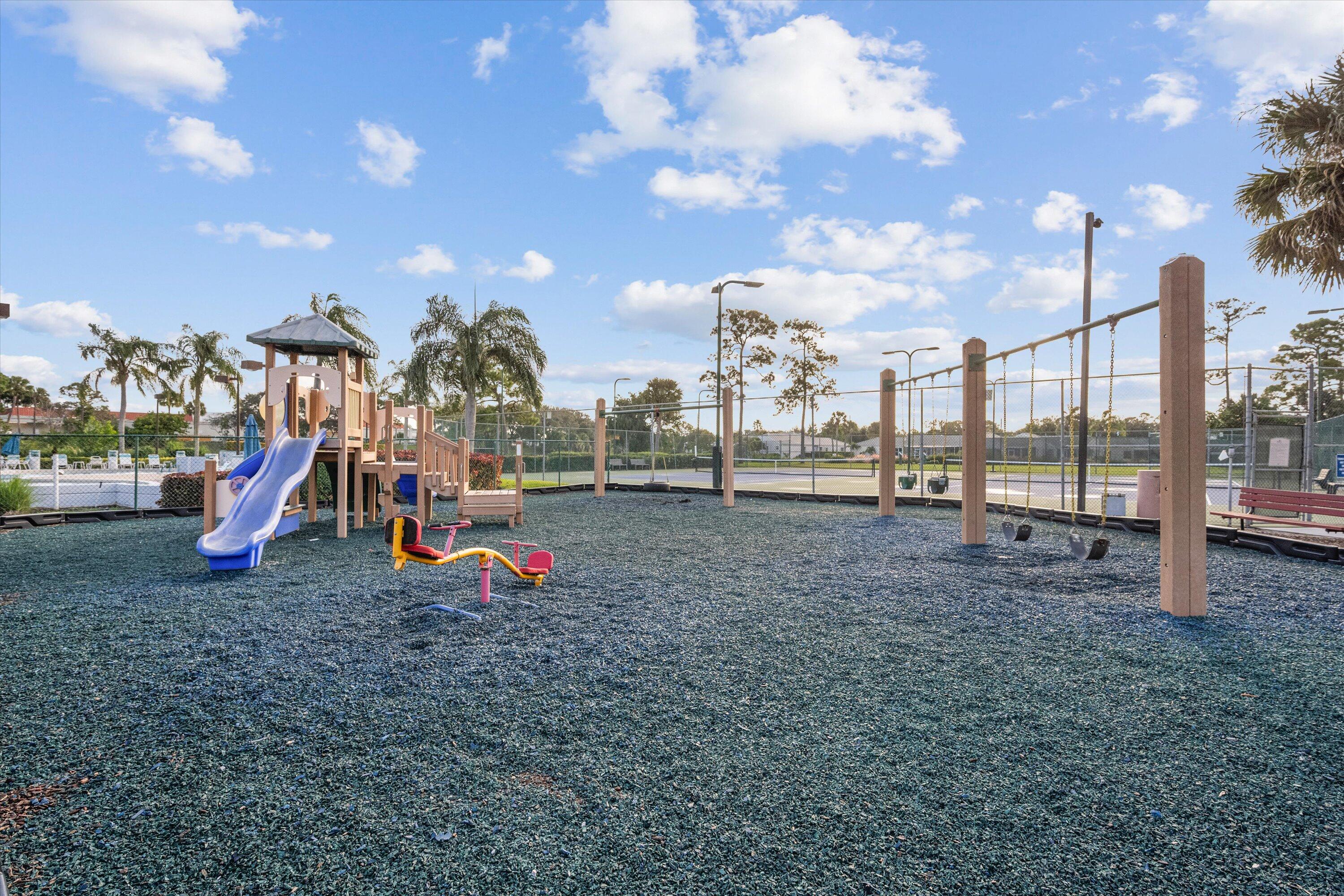 103 Harbour Pointe Way Greenacres, FL 33413 - Photo 28 of 32 a view of outdoor space with playground and green space