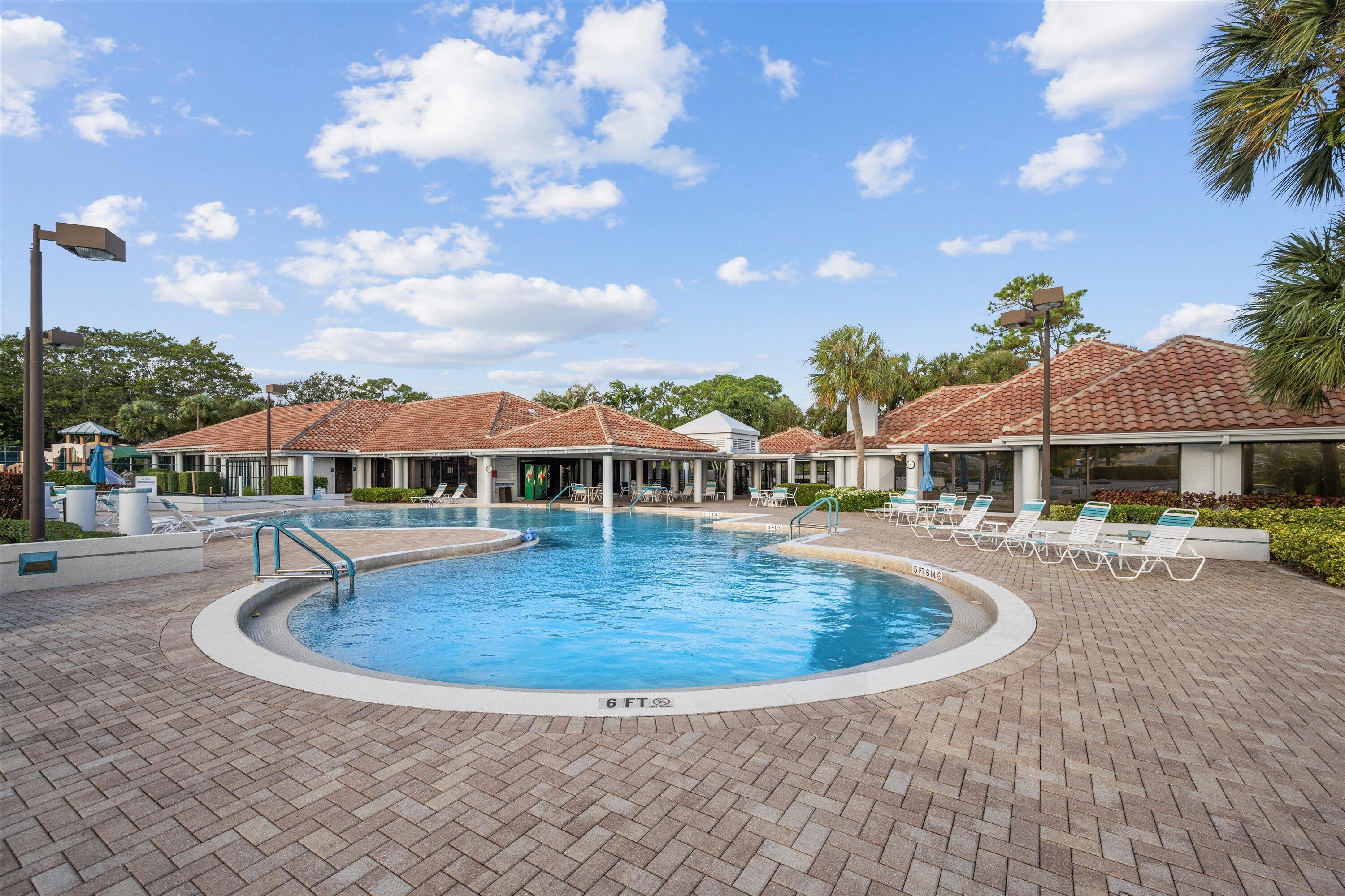 103 Harbour Pointe Way Greenacres, FL 33413 - Photo 29 of 32 a view of a house with swimming pool and sitting area