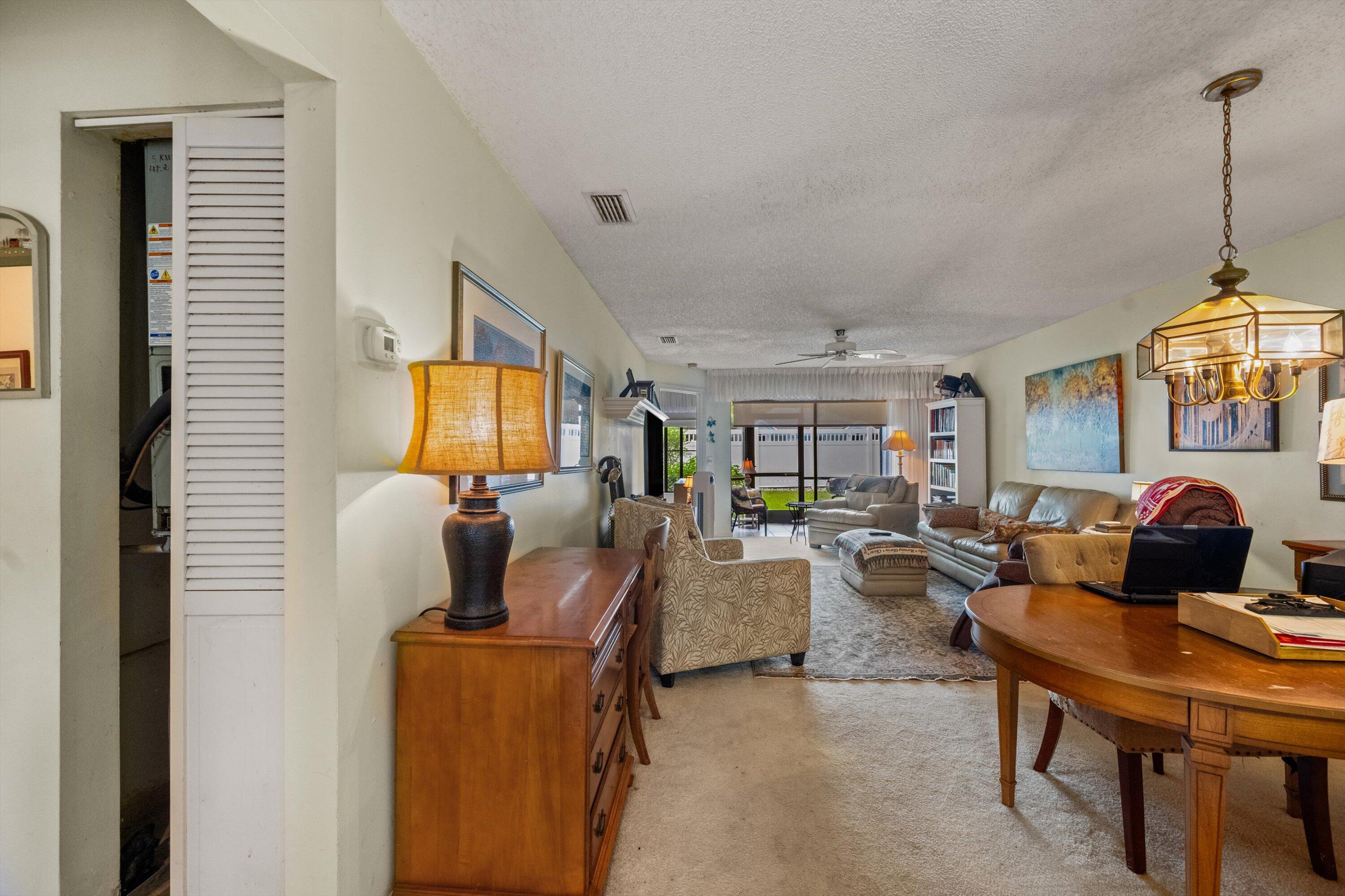 103 Harbour Pointe Way Greenacres, FL 33413 - Photo 5 of 32 a living room with furniture and a flat screen tv