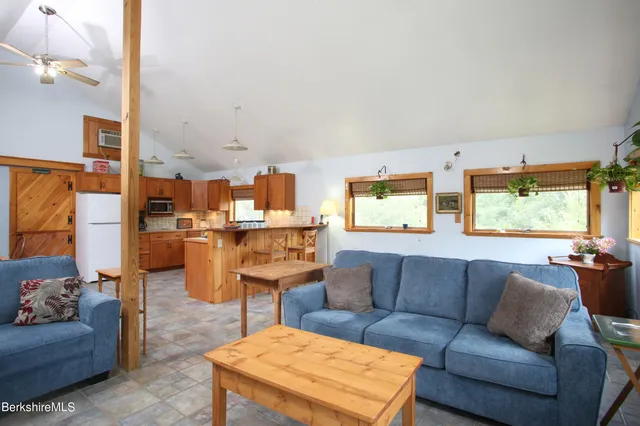 a bedroom with furniture and a window