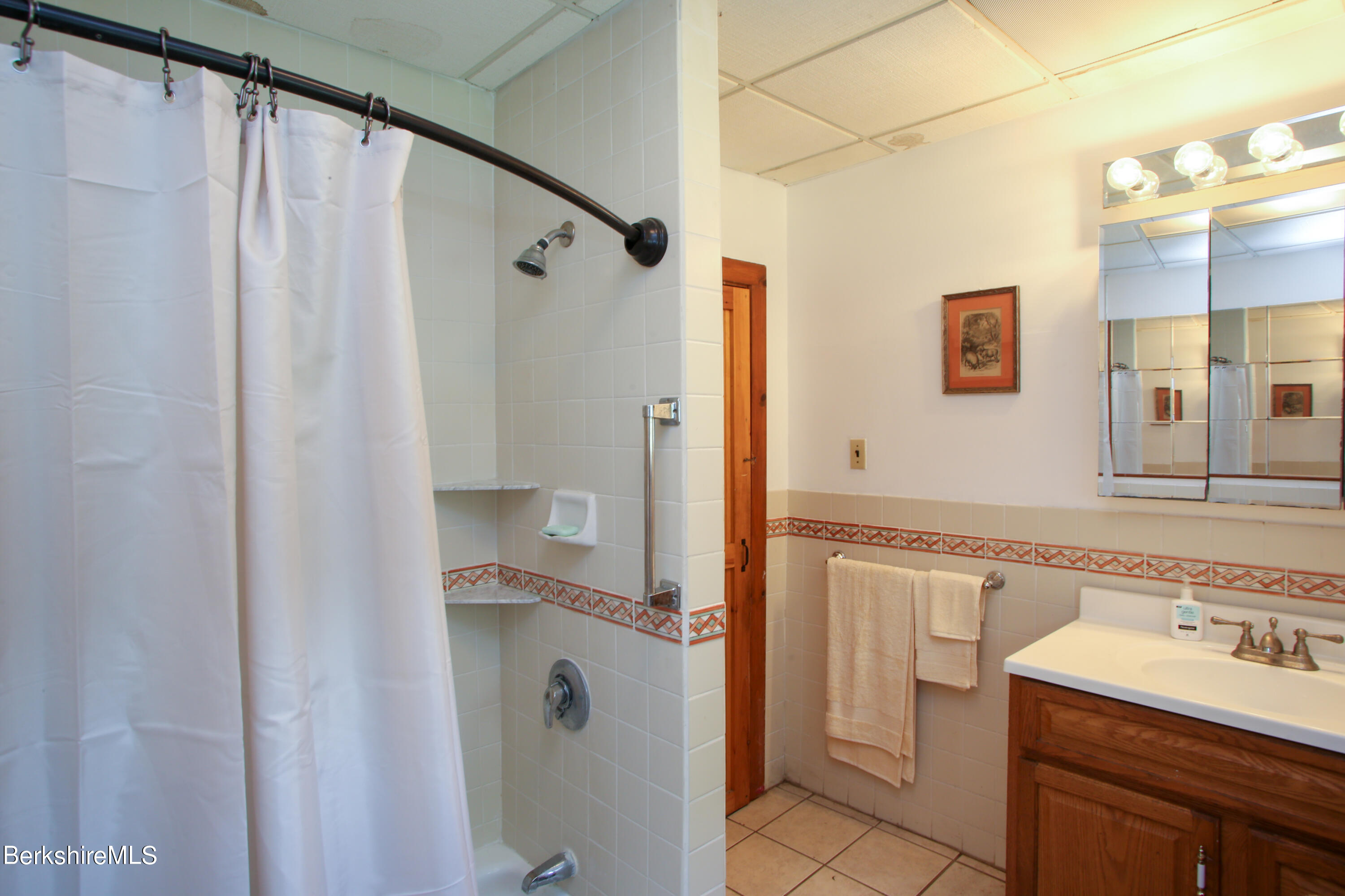 14 S Road Heath, MA 01346 - Photo 14 of 36 a bathroom with a granite countertop sink mirror and shower