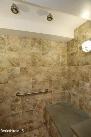 a view of walk in closet and window