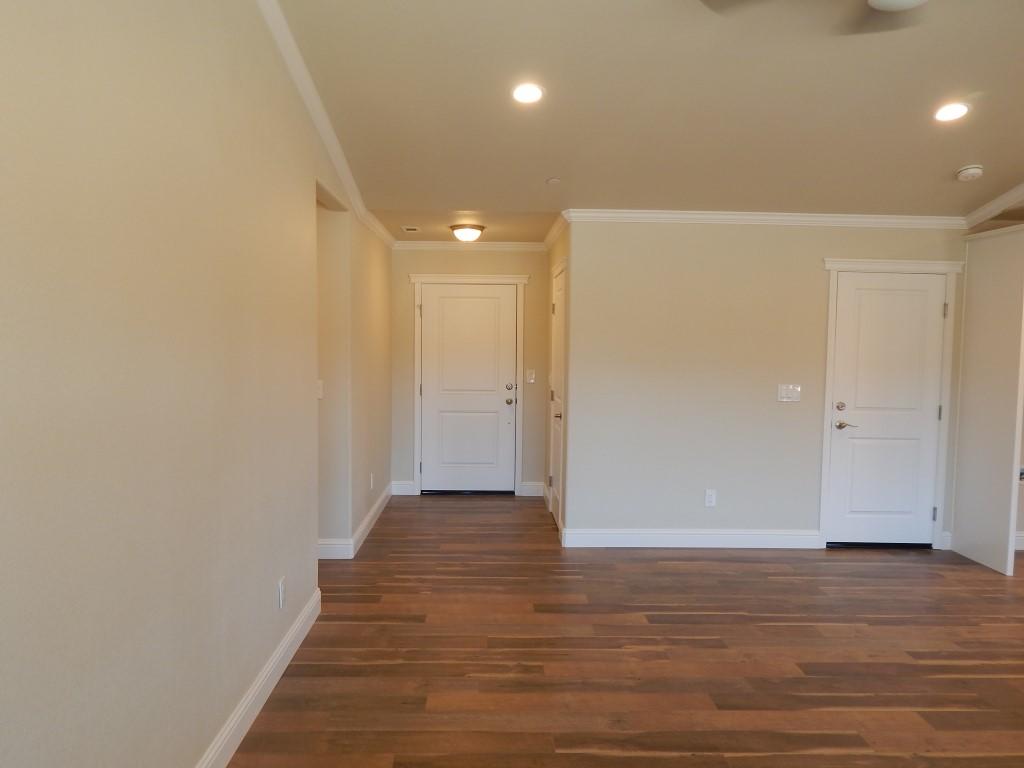 11341 Puffin Way Redding, CA 96003 - Photo 11 of 25 a view of a hallway with wooden floor
