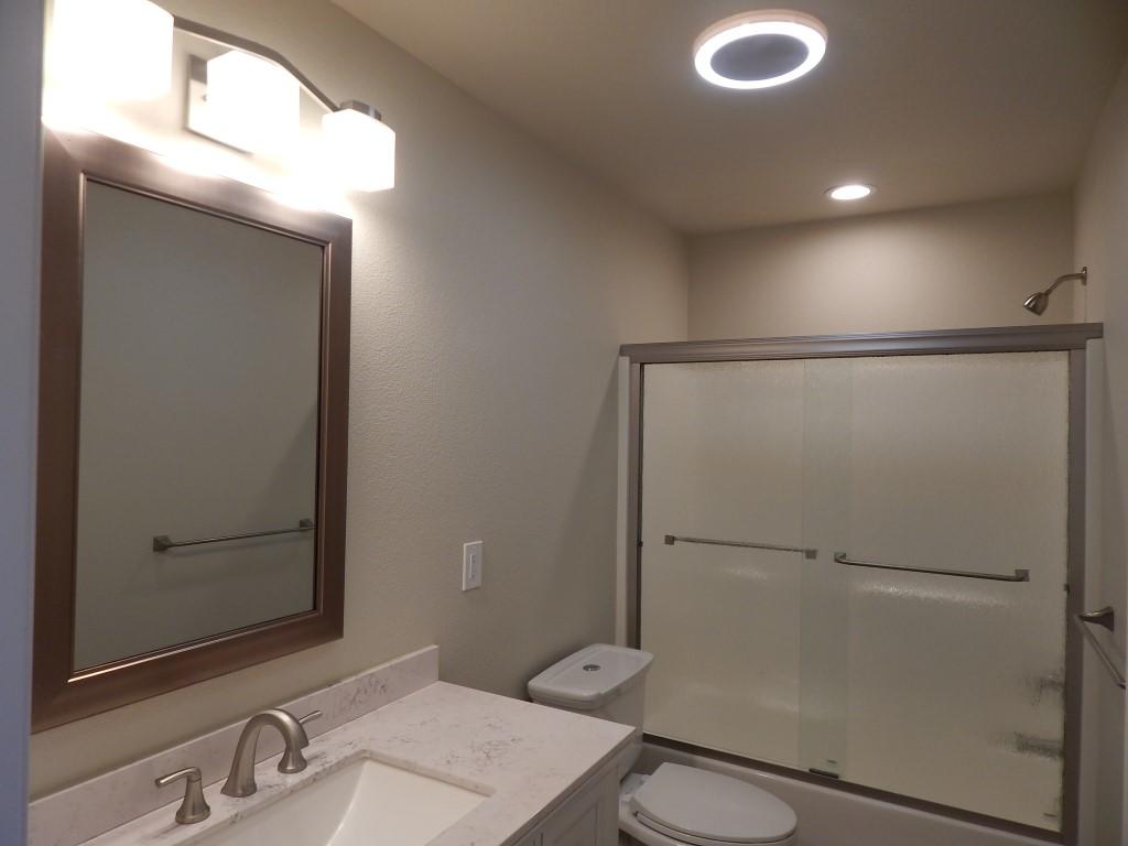 11341 Puffin Way Redding, CA 96003 - Photo 13 of 25 a bathroom with a sink a toilet and shower