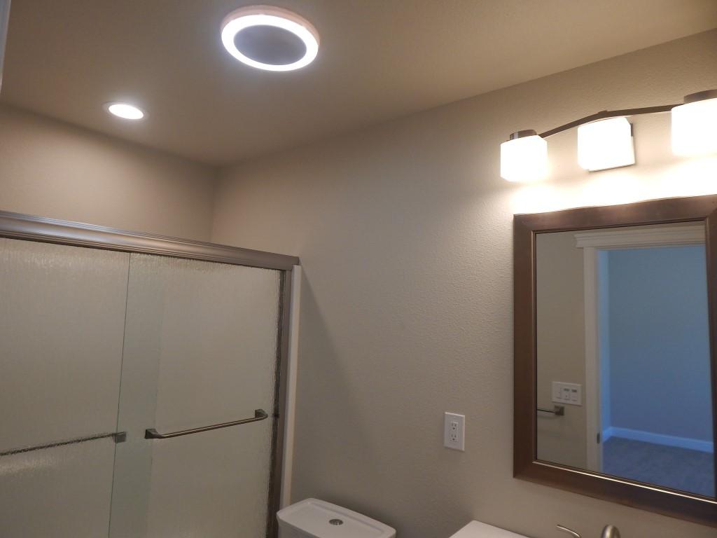 11341 Puffin Way Redding, CA 96003 - Photo 18 of 25 a bathroom with a shower a toilet and a sink