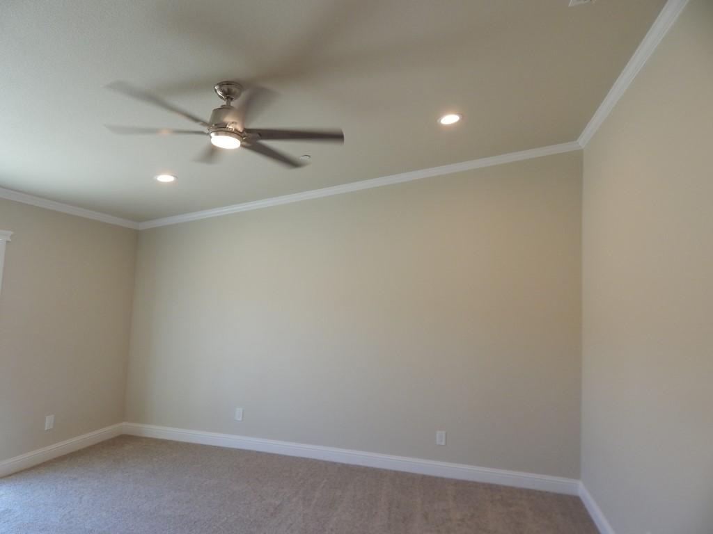 11341 Puffin Way Redding, CA 96003 - Photo 20 of 25 an empty room with a fan and a fan