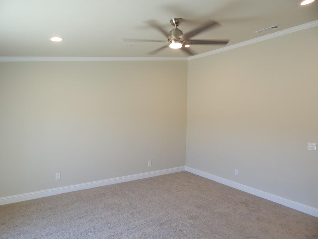 11341 Puffin Way Redding, CA 96003 - Photo 24 of 25 an empty room with a fan & a window