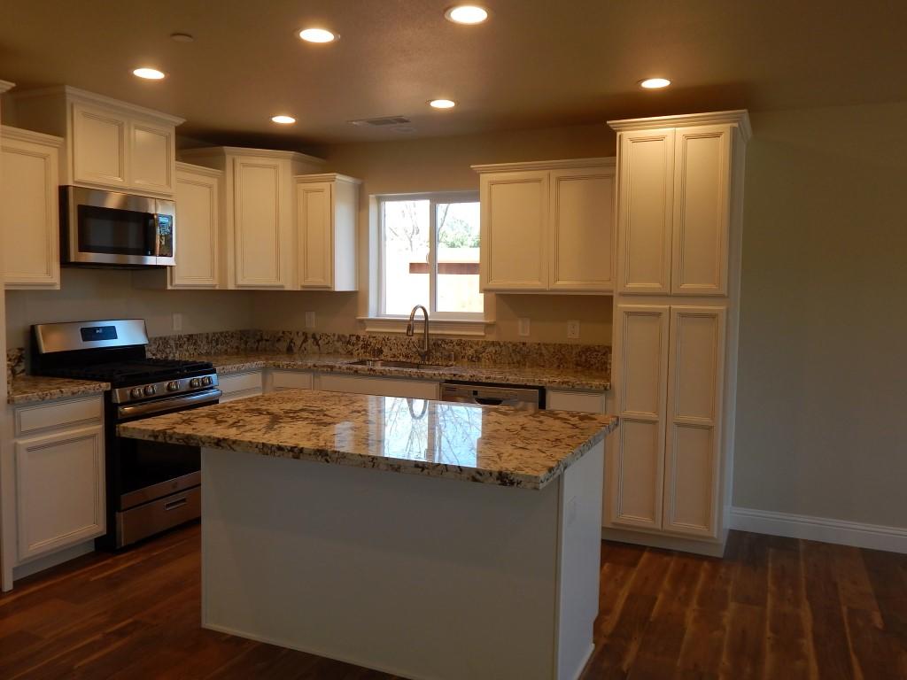 11341 Puffin Way Redding, CA 96003 - Photo 6 of 25 a kitchen with granite countertop stainless steel appliances and counter space