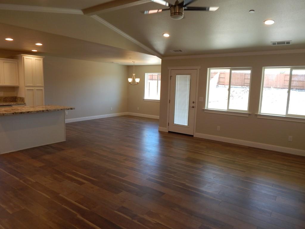 11341 Puffin Way Redding, CA 96003 - Photo 10 of 25 an empty room with wooden floor and windows