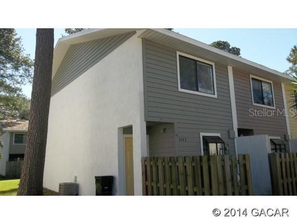 2123 Southwest 39 Way Gainesville, FL 32607 - Photo 1 of 1 a black and white photo of a house