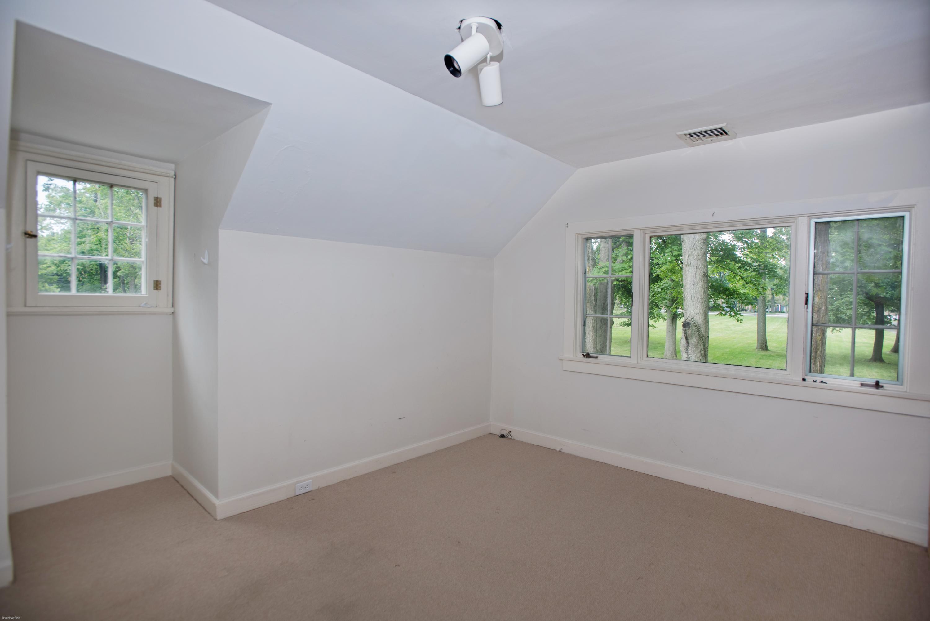 65 Oenoke Ridge New Canaan, CT 06840 - Photo 12 of 22 an empty room with windows