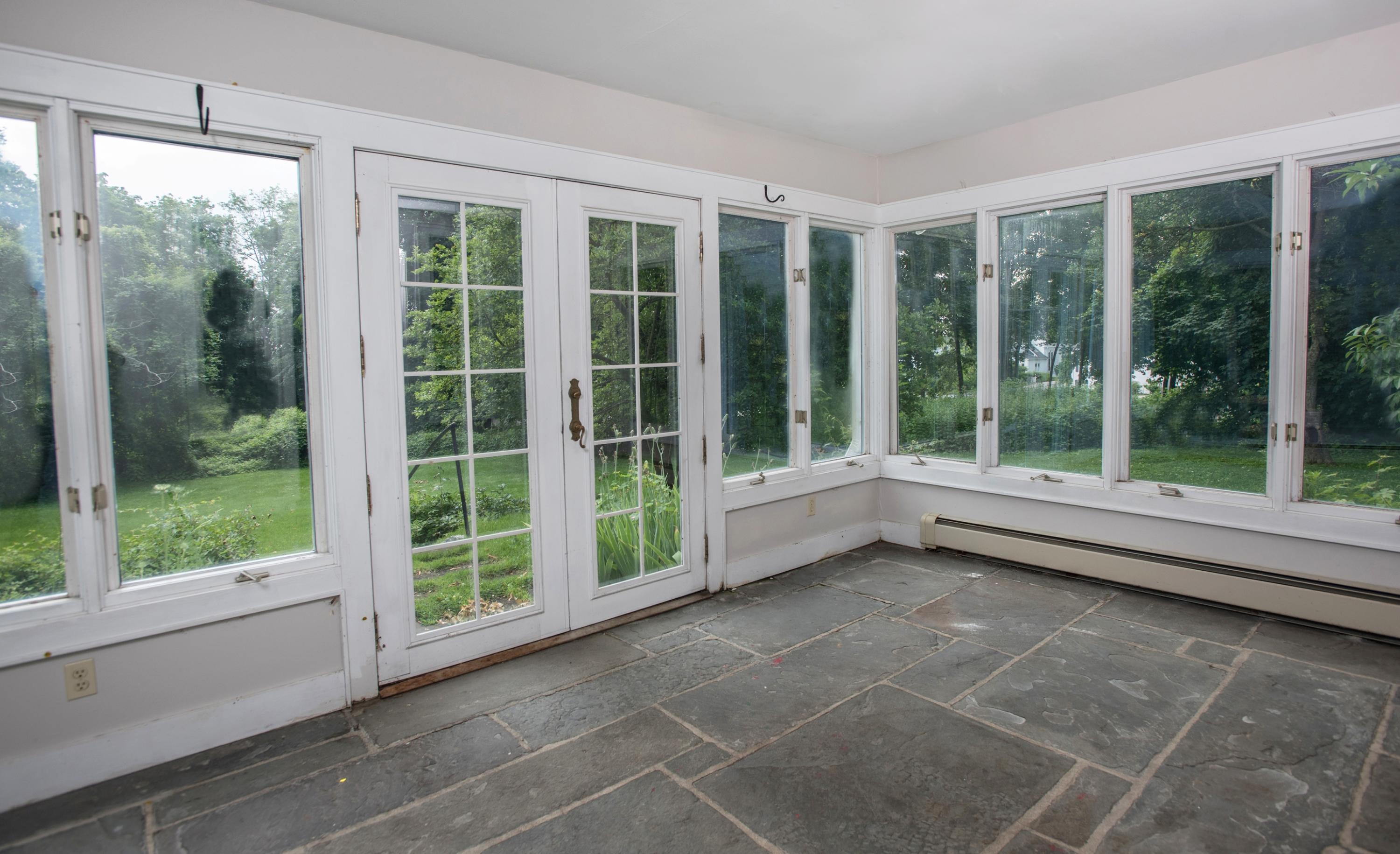 65 Oenoke Ridge New Canaan, CT 06840 - Photo 17 of 22 a view of a room with a large window