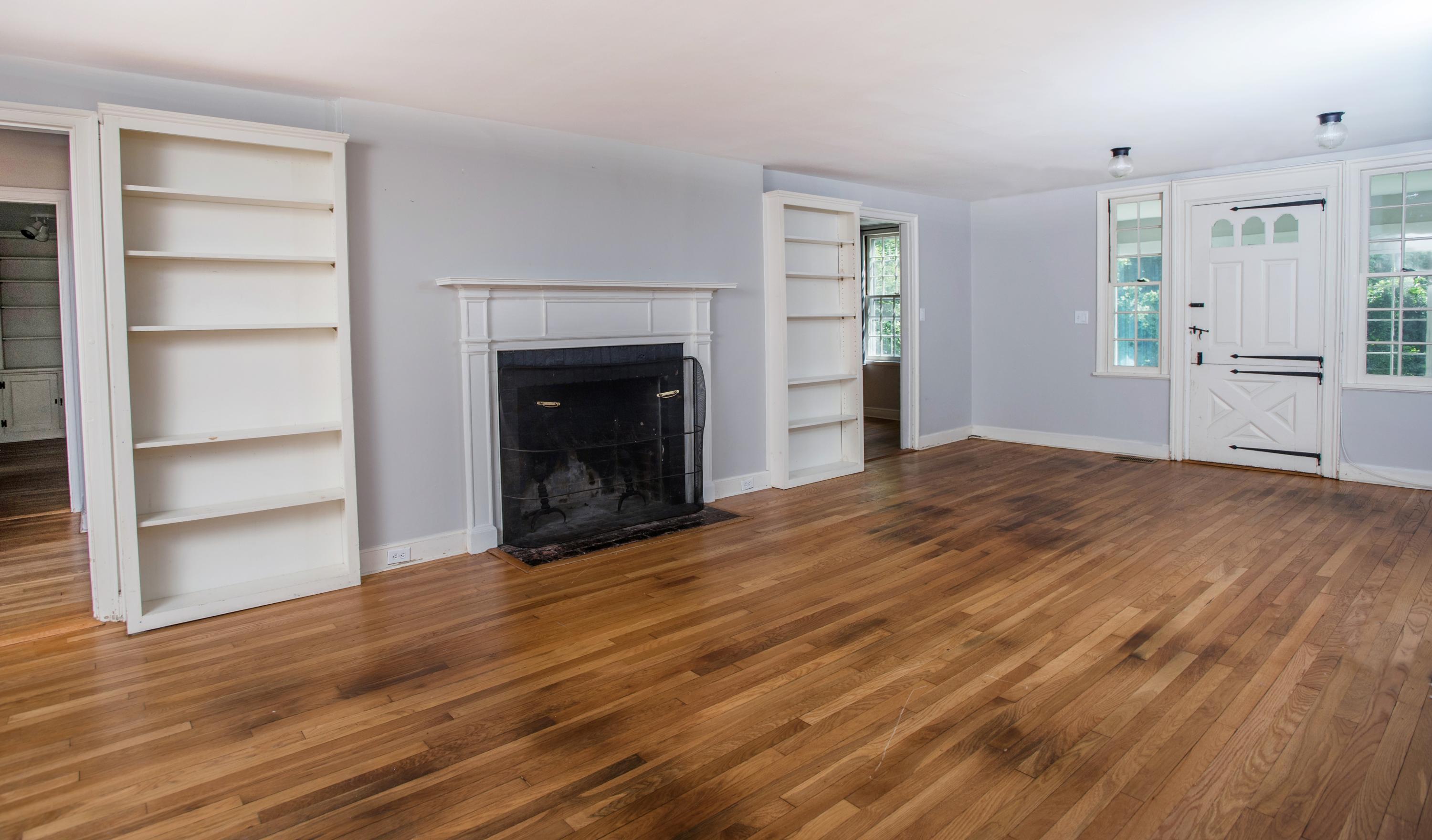 65 Oenoke Ridge New Canaan, CT 06840 - Photo 4 of 22 a view of empty room with wooden floor and fireplace