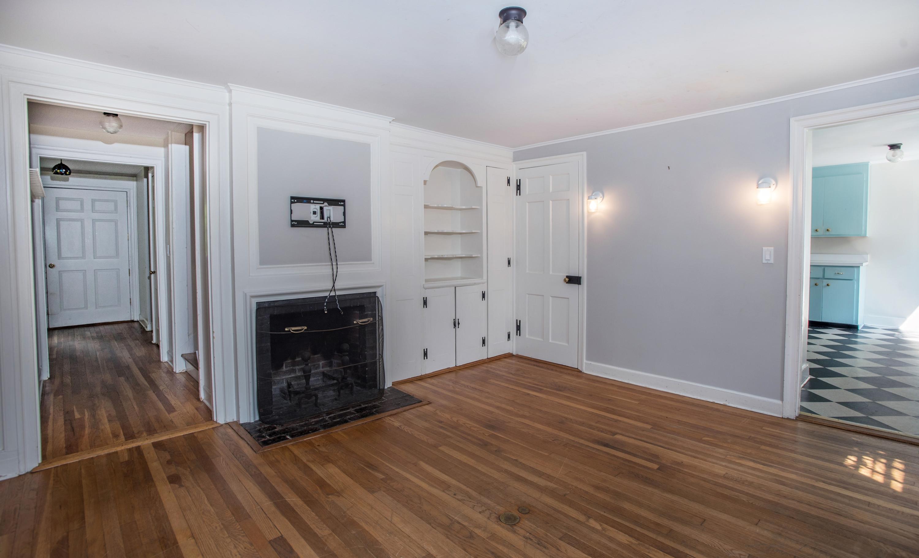 65 Oenoke Ridge New Canaan, CT 06840 - Photo 5 of 22 a view of empty room with wooden floor and fireplace