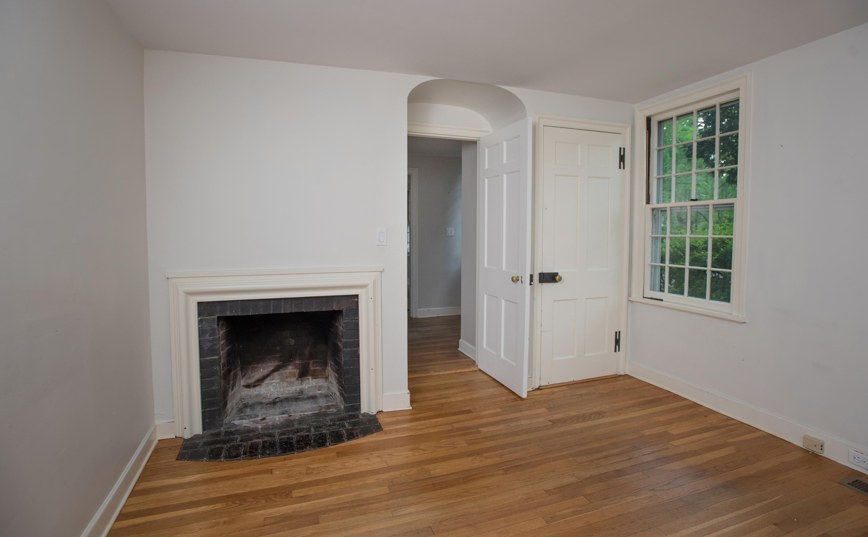 65 Oenoke Ridge New Canaan, CT 06840 - Photo 9 of 22 a view of a livingroom with wooden floor and a fireplace