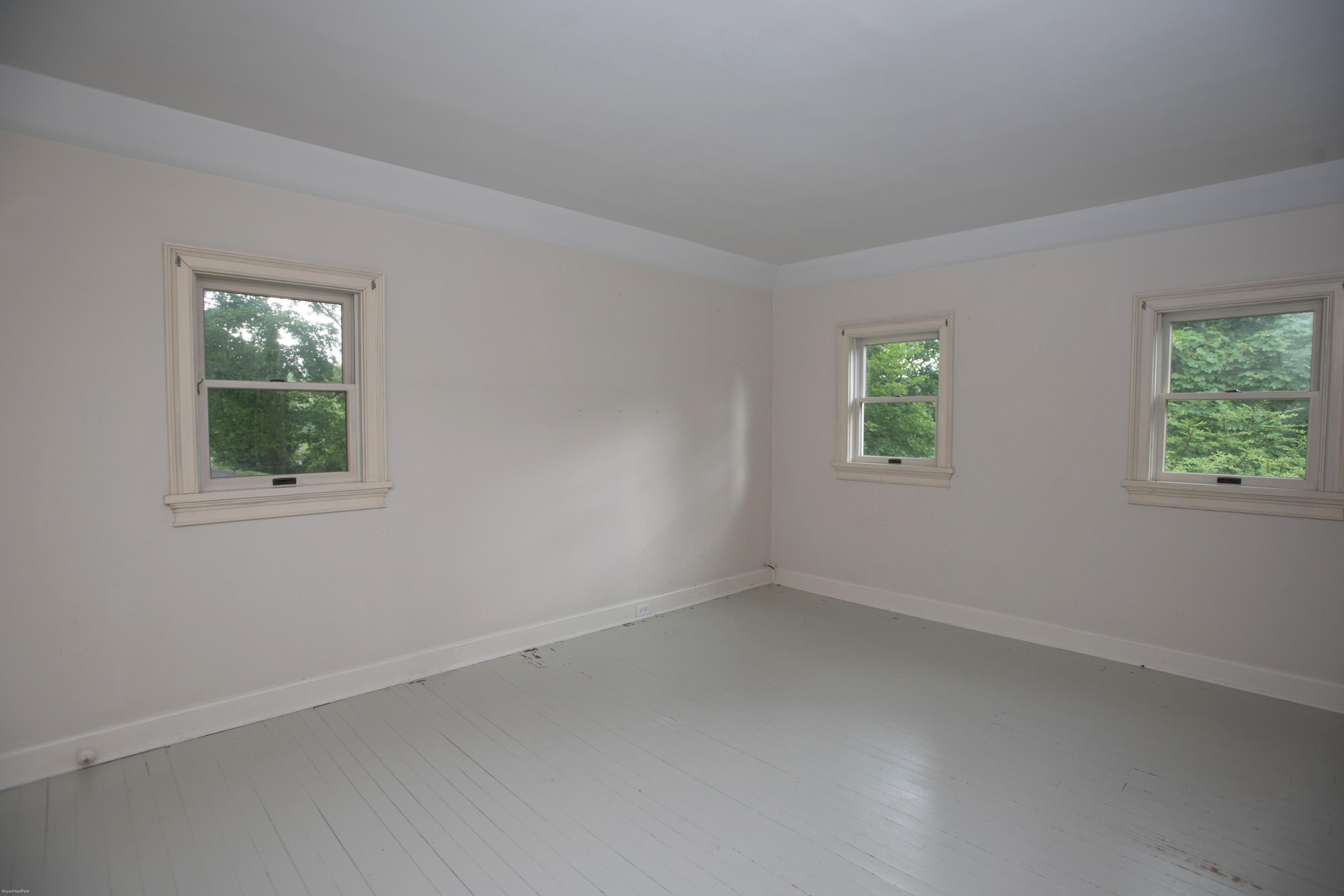 65 Oenoke Ridge New Canaan, CT 06840 - Photo 10 of 22 an empty room with windows