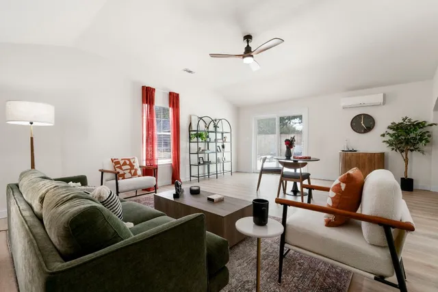 a living room with furniture and a large window