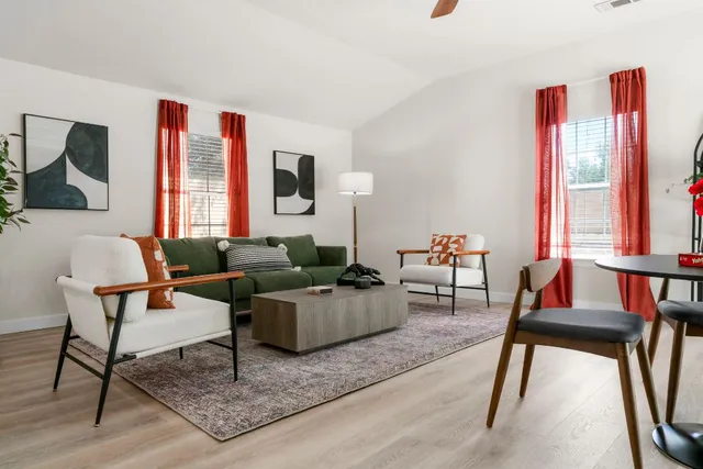 a living room with furniture and a window