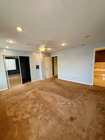 a view of a big room with closet and wooden floor