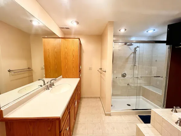 a bathroom with a shower and a sink