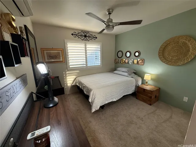 a bedroom with a bed and a mirror