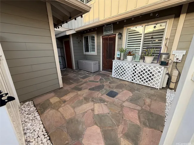 a front view of a house with a large window