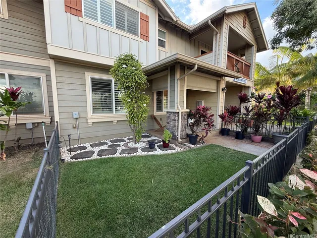 a front view of house with yard and outdoor seating