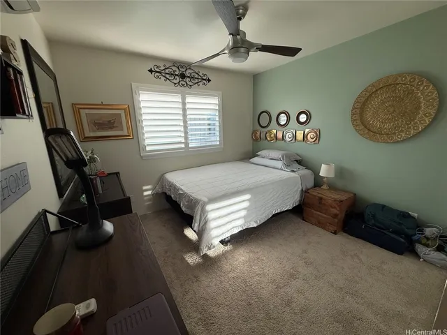 a bedroom with a bed furniture and a window