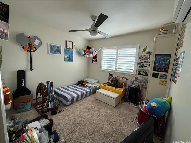 a bedroom with furniture and a window