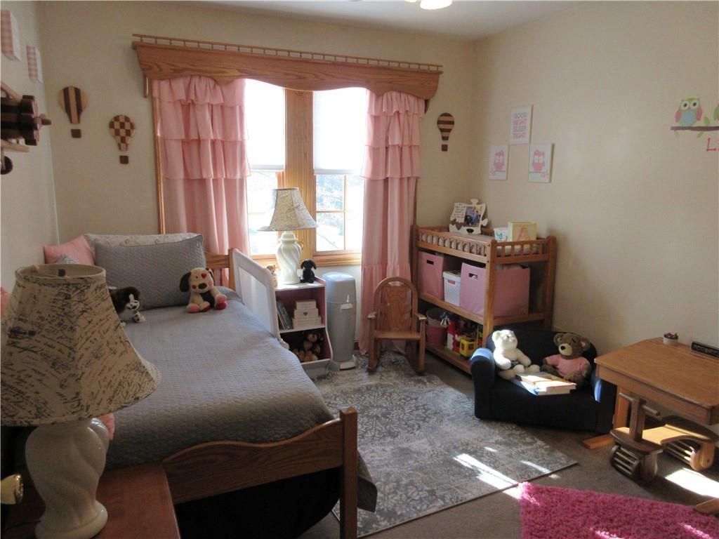 171 Bear Creek Road Prospect, PA 16052 - Photo 21 of 28 a bed room with a bed and a couch