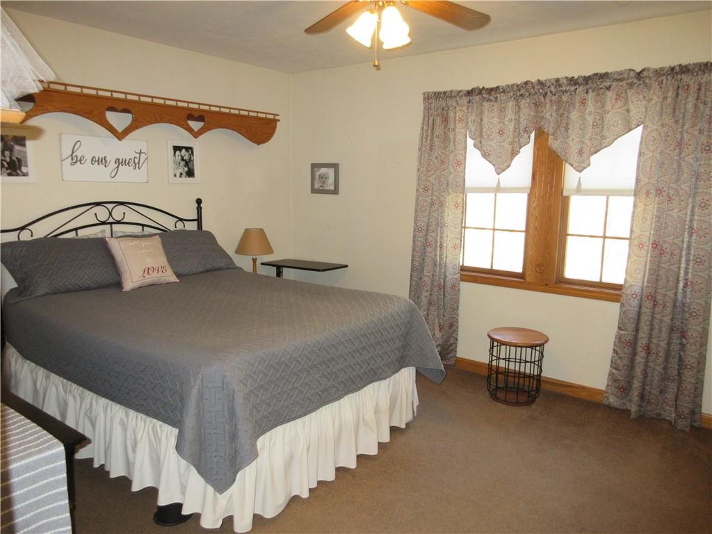 171 Bear Creek Road Prospect, PA 16052 - Photo 22 of 28 a bedroom with a bed and a chandelier