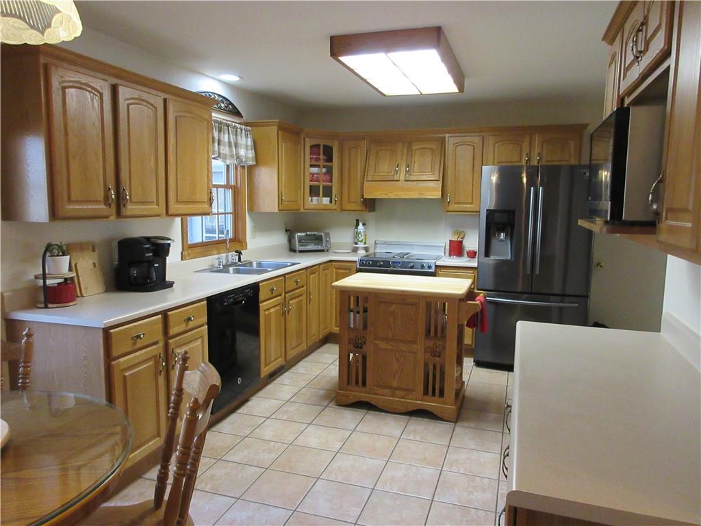 171 Bear Creek Road Prospect, PA 16052 - Photo 24 of 28 a kitchen with a sink a counter top space cabinets and stainless steel appliances