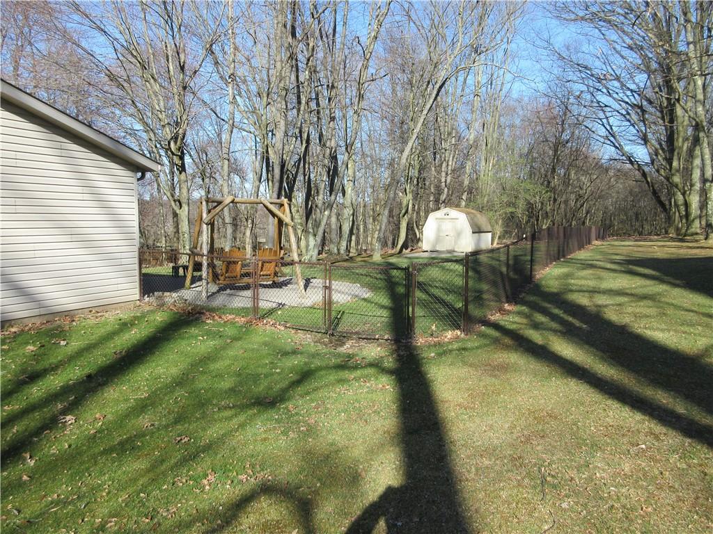 171 Bear Creek Road Prospect, PA 16052 - Photo 4 of 28 a backyard of a house with a table and chairs