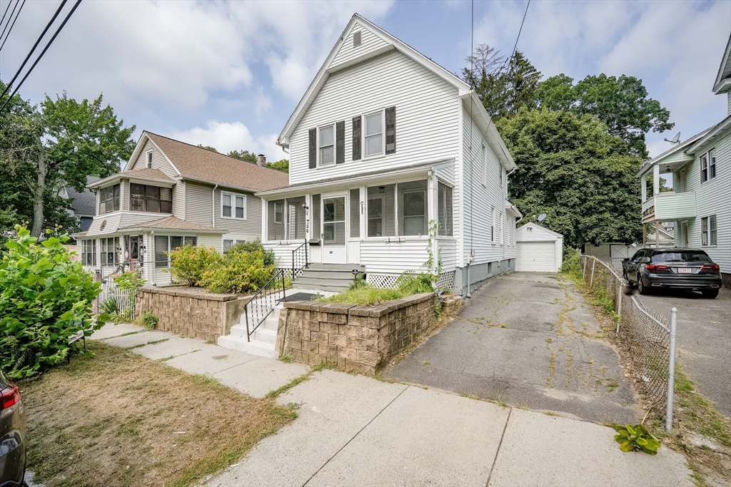 30 Beauchamp Street Springfield, MA 01107 - Photo 1 of 30 a front view of a house with a garden and outdoor seating