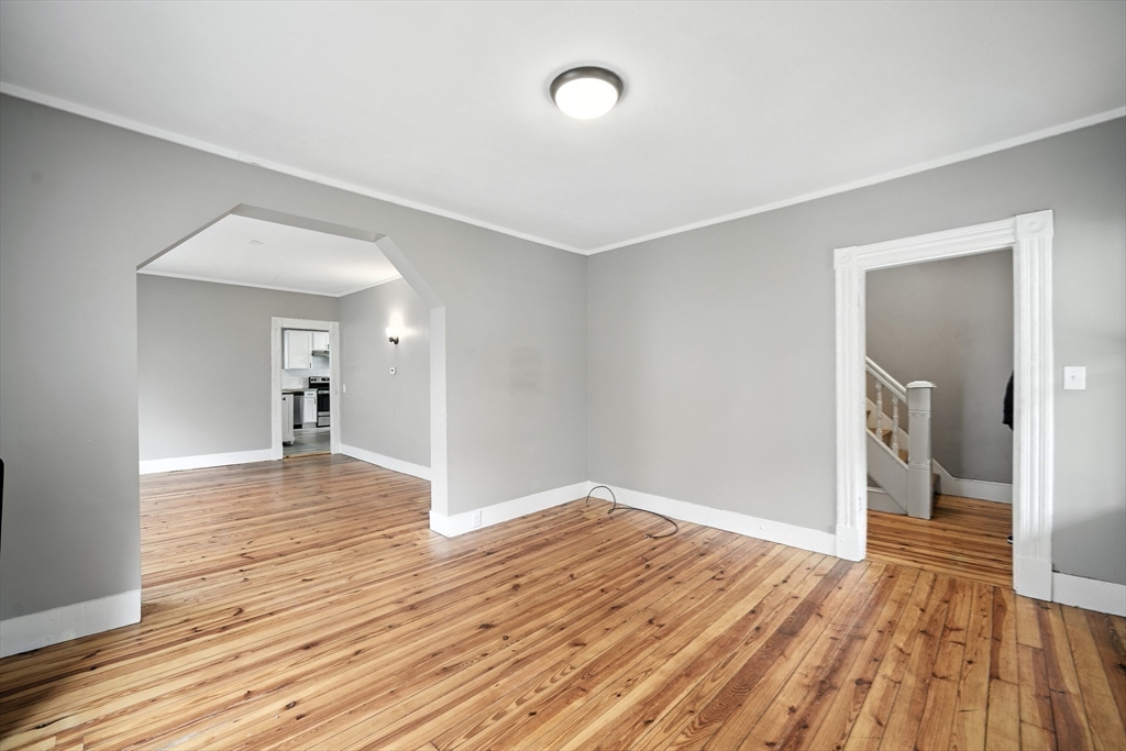 30 Beauchamp Street Springfield, MA 01107 - Photo 11 of 30 a view of a room with wooden floor and a ceiling fan