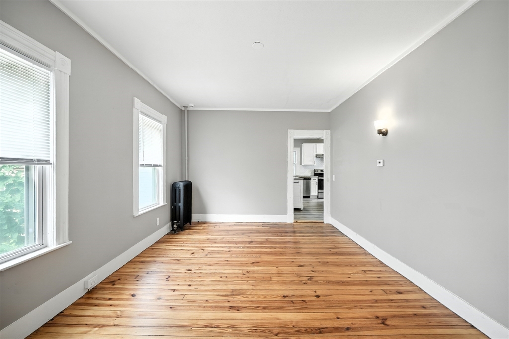 30 Beauchamp Street Springfield, MA 01107 - Photo 14 of 30 a view of a big room with wooden floor and windows
