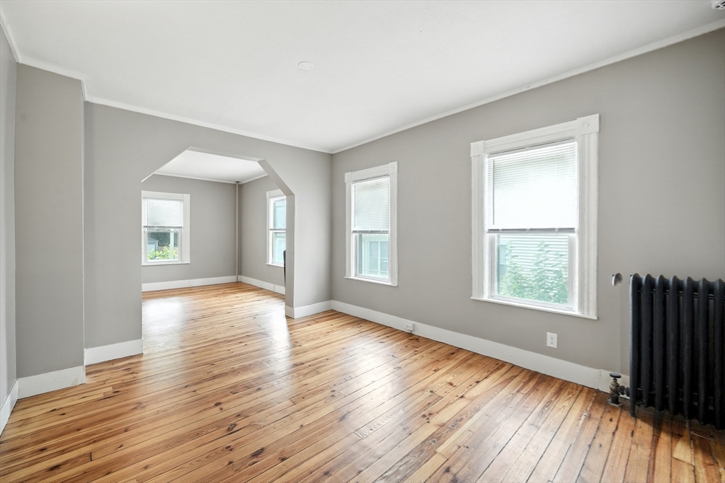 30 Beauchamp Street Springfield, MA 01107 - Photo 15 of 30 a view of an empty room with wooden floor and a window