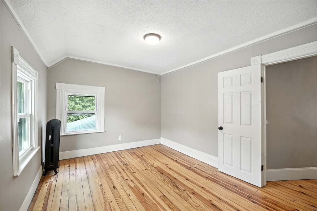 30 Beauchamp Street Springfield, MA 01107 - Photo 21 of 30 an empty room with wooden floor and windows