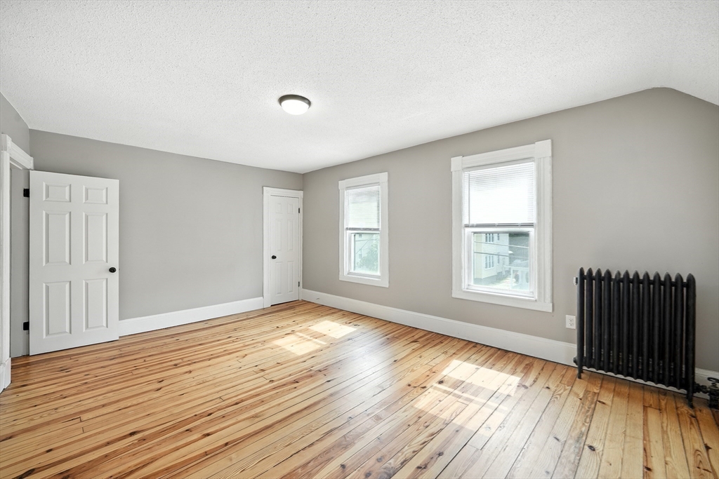 30 Beauchamp Street Springfield, MA 01107 - Photo 23 of 30 an empty room with wooden floor and windows